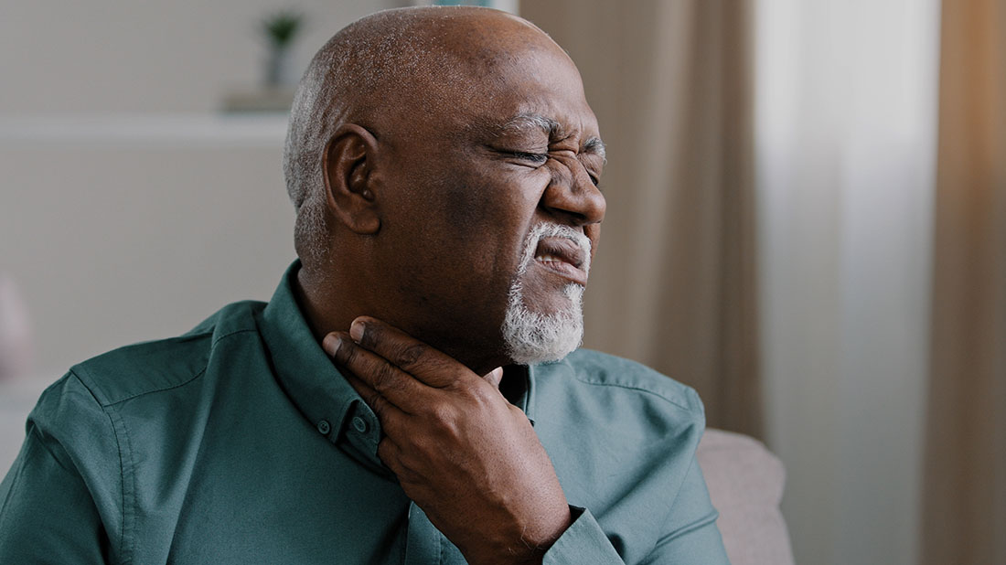 Man with throat discomfort