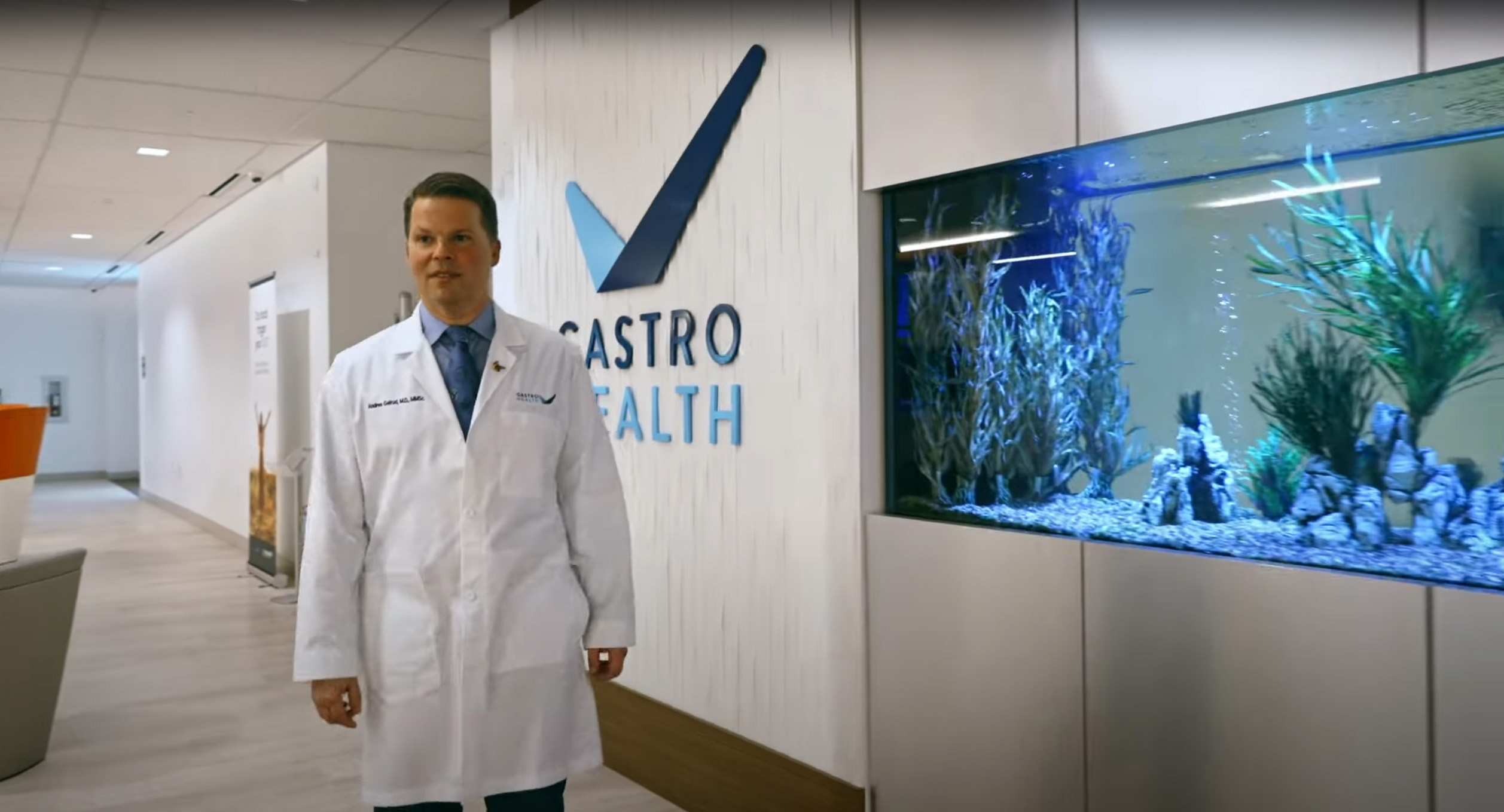 Dr Andres Gelrud walking down hallway-edit